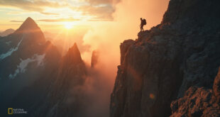 Dangerous rocky cliff edge on Mount Whitney illuminated by golden sunrise light, highlighting the perils of mountain hiking