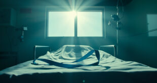 Empty hospital recovery room with blue medical sling on bed, surrounded by rehabilitation equipment in sterile lighting
