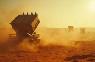 Abandoned military base with empty missile launch pad under attack in deserted desert compound