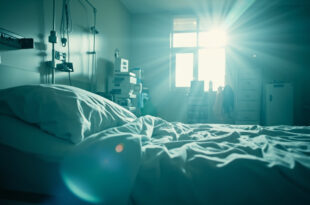 Empty hospital room at dawn with unmanned medical equipment and vacant bed with charts, bathed in soft blue light.