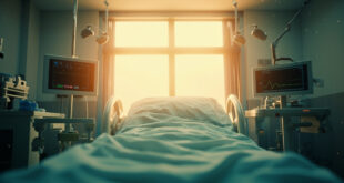 Empty hospital room with medical equipment bathed in golden healing light, suggesting hope in a sterile facility