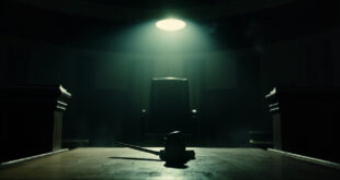 Empty wooden judge's bench with gavel in a deserted courthouse at dusk, captured after final judgment