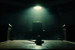 Empty wooden judge's bench with gavel in a deserted courthouse at dusk, captured after final judgment