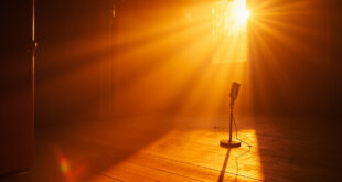 Vintage microphone stands alone in an abandoned recording studio bathed in golden sunset light, symbolizing music legacy