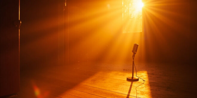 Vintage microphone stands alone in an abandoned recording studio bathed in golden sunset light, symbolizing music legacy