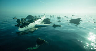 Aircraft wreckage debris floating on calm blue Pacific Ocean waters off California coast after aviation incident