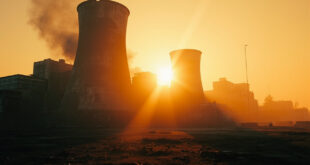 Abandoned nuclear facility with damaged cooling towers at dawn, concrete structures silhouetted against orange sky