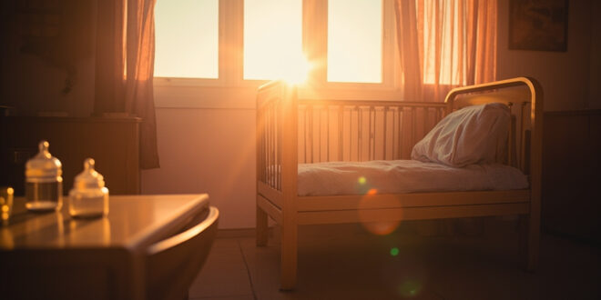 Empty hospital nursery at dawn with an unoccupied crib, folded blankets, and unopened baby bottles awaiting a new arrival