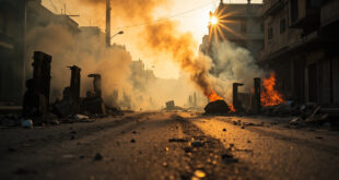 Smoke rises from abandoned barricades on a debris-covered street at dawn, with overturned objects and scattered stones