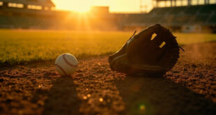 Empty baseball glove on pitcher's mound with lone baseball on home plate in abandoned stadium at sunset