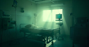 Empty hospital bed with monitoring equipment and IV stand in a sterile intensive care unit with clinical lighting