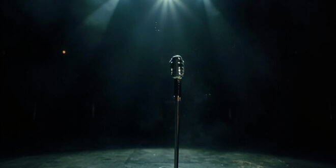 Solitary vintage microphone stand illuminated by spotlight on empty, darkened concert stage after final show