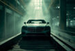 Unfinished Mercedes-Benz sedan sits abandoned on a motionless assembly line in an empty automotive factory