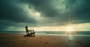 Empty wooden beach chairs on rain-soaked sand at a deserted German coastal beach under stormy grey summer skies