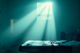 Medical chart and stethoscope illuminated on examination table in sterile hospital room highlighting bowel cancer test results