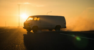 Abandoned white van on desolate Interstate 87 at dusk, bathed in amber light, suggesting a missing child emergency