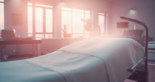Empty surgical suite with pristine instruments on metal table and freshly made medical bed in softly lit sterile facility