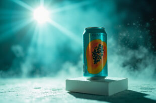 Aqua-colored papaya-designed soda can displayed on stand in clean product photography studio with dramatic lighting