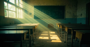 Empty school desks arranged in rows in an abandoned classroom with morning light streaming through windows