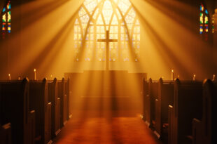 Empty church sanctuary with sunlight streaming through stained glass windows, illuminating wooden pews and altar cross