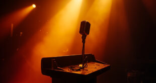Silent microphone on an empty wooden pulpit stands abandoned in a once-bustling television studio bathed in amber light.