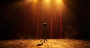 Abandoned vintage microphone stands alone on empty wooden stage in dimmed theater with closed burgundy curtains