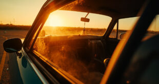 Empty child car seat visible through window of abandoned vehicle in deserted parking lot under scorching sun