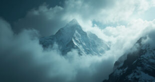 Towering Nanga Parbat mountain peak shrouded in mist and clouds against a stormy gray sky, capturing silent tragedy
