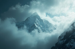Towering Nanga Parbat mountain peak shrouded in mist and clouds against a stormy gray sky, capturing silent tragedy