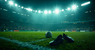 Abandoned football boots on grass beside a solitary ball in an empty stadium with dramatic lighting