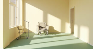 Modern accessible home interior with medical equipment, empty wheelchair, and comfortable seating in soft lighting