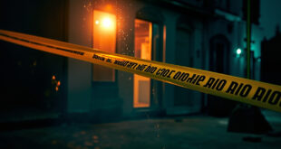 Sealed house entrance with police tape and investigation barriers on an empty residential street in Prague suburb