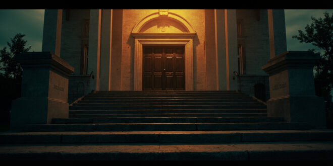 Empty stone courthouse steps at dusk, leading to closed doors adorned with justice scales in somber lighting