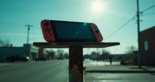 Abandoned Nintendo Switch perched on an empty parking sign in a deserted small-town parking lot at dusk