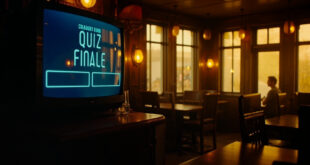 Television screen in pub showing quiz show results with empty chairs and tables around