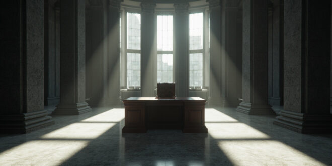 Empty leather chair at wooden desk in formal government building interior with scattered papers
