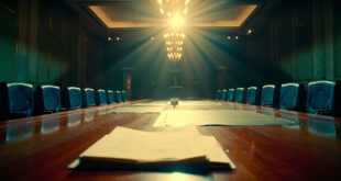 Empty diplomatic conference room with scattered documents on polished table, official seals visible in formal setting
