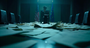 Abandoned negotiation table with scattered trade documents in empty corporate boardroom featuring EU and US flags
