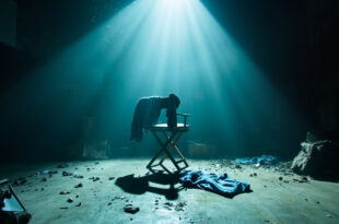 Abandoned television studio with blue jeans draped over empty director's chair amid scattered campaign materials