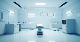 Empty hospital operating room with surgical lights and medical equipment prepared for emergency surgery