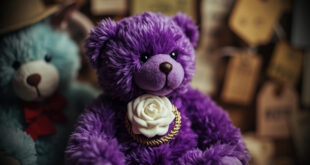 Purple commemorative bear toy with white rose emblem displayed against neutral background with soft lighting