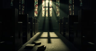 Empty wooden church pews in dim cathedral with stained glass windows casting colored light across the floor.