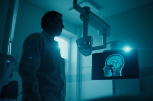 Medical brain scan displaying on illuminated monitor in sterile hospital examination room during emergency diagnosis