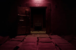 Open vault door revealing empty interior with scattered budget documents and accounting ledgers on marble floor.
