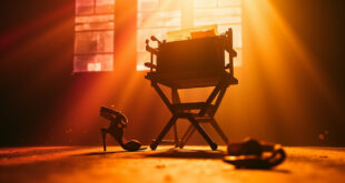 Empty director's chair with final script in abandoned film studio at golden hour, vintage typewriter nearby, high heels on floor