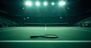 Tennis racket abandoned on empty green court with net casting shadows under stadium lights