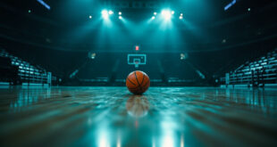 Empty basketball arena with a single ball on the court under bright overhead lights