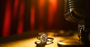 Sparkling diamond ring positioned next to classic recording microphone in warm studio lighting