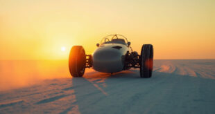 Abandoned racing vehicle on Bonneville Salt Flats at dusk, with solitary tracks stretching across the stark white desert