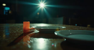 Abandoned EpiPen and medical emergency kit sit beside untouched food on empty restaurant table in dim lighting